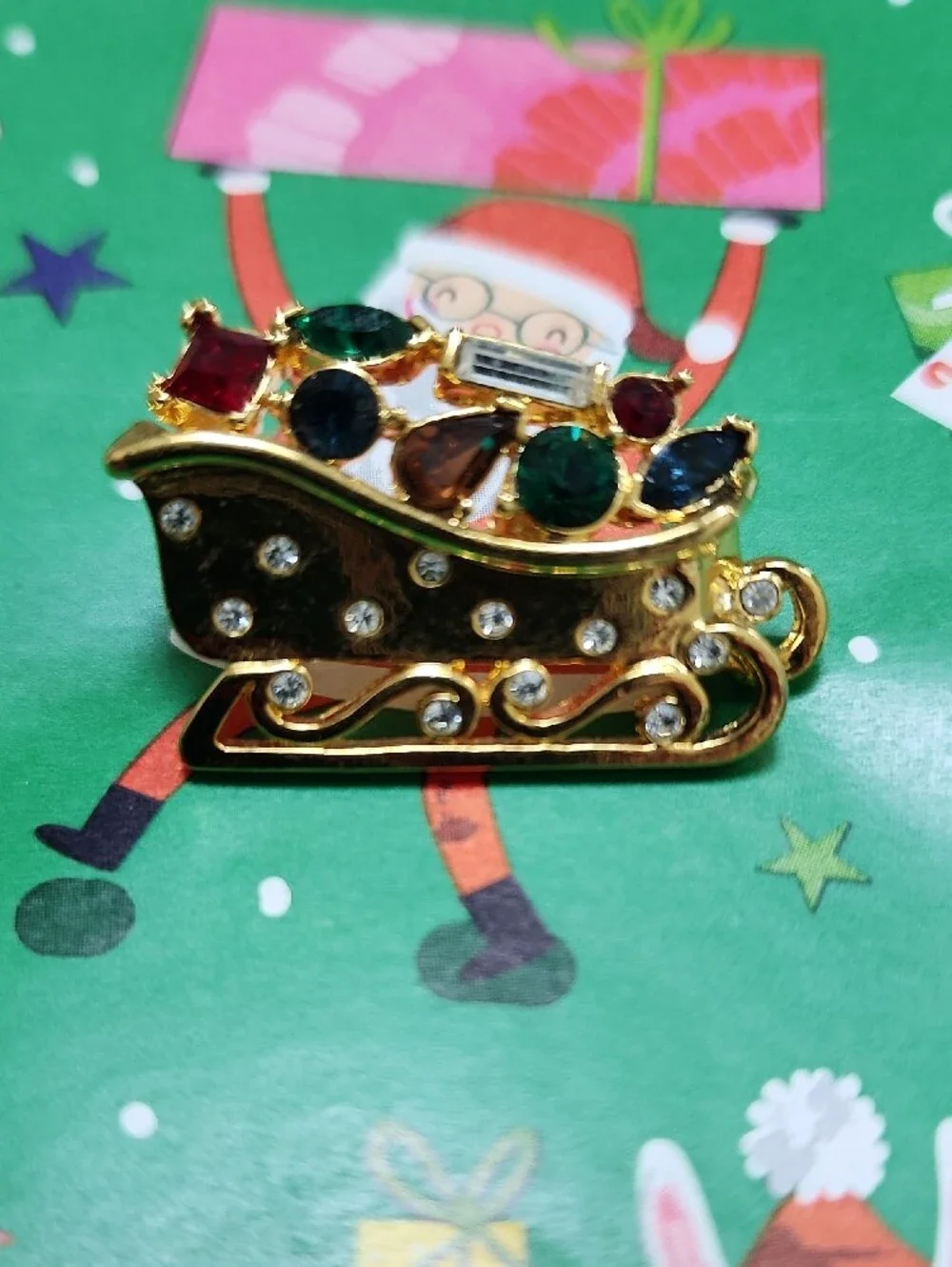 Monet Gold-tone Festive Sleigh Brooch with Multicolor Rhinestones